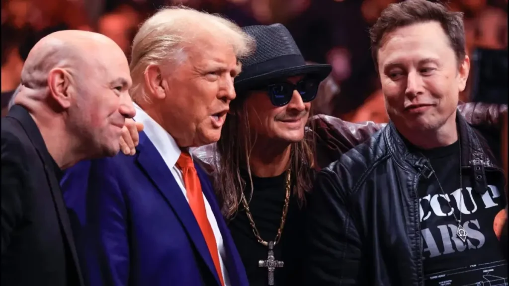 Is Omega Symbolizing the End? Internet Speculates Over Elon Musk's Necklace at UFC Fight Attended with Trump