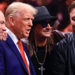 Is Omega Symbolizing the End? Internet Speculates Over Elon Musk's Necklace at UFC Fight Attended with Trump